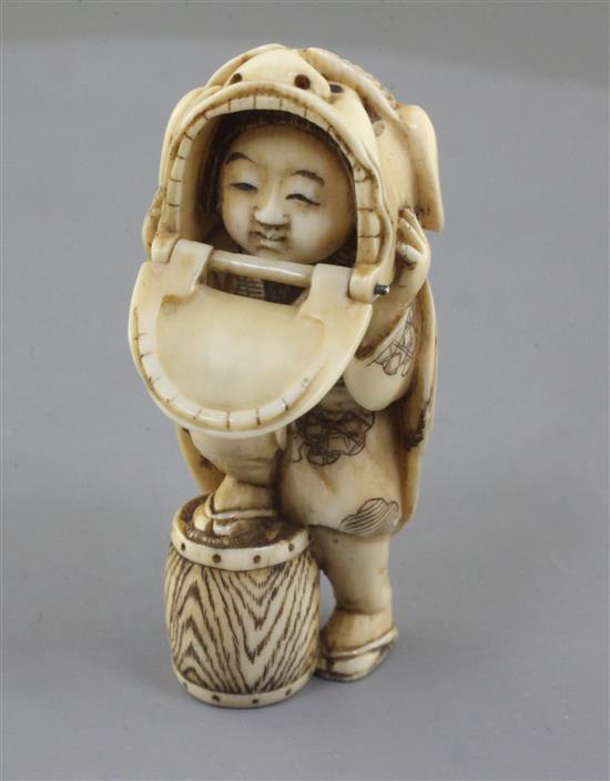 A Japanese ivory netsuke of a shishimai dancer, Meiji period, signed Nagatame, h. 5.1cm